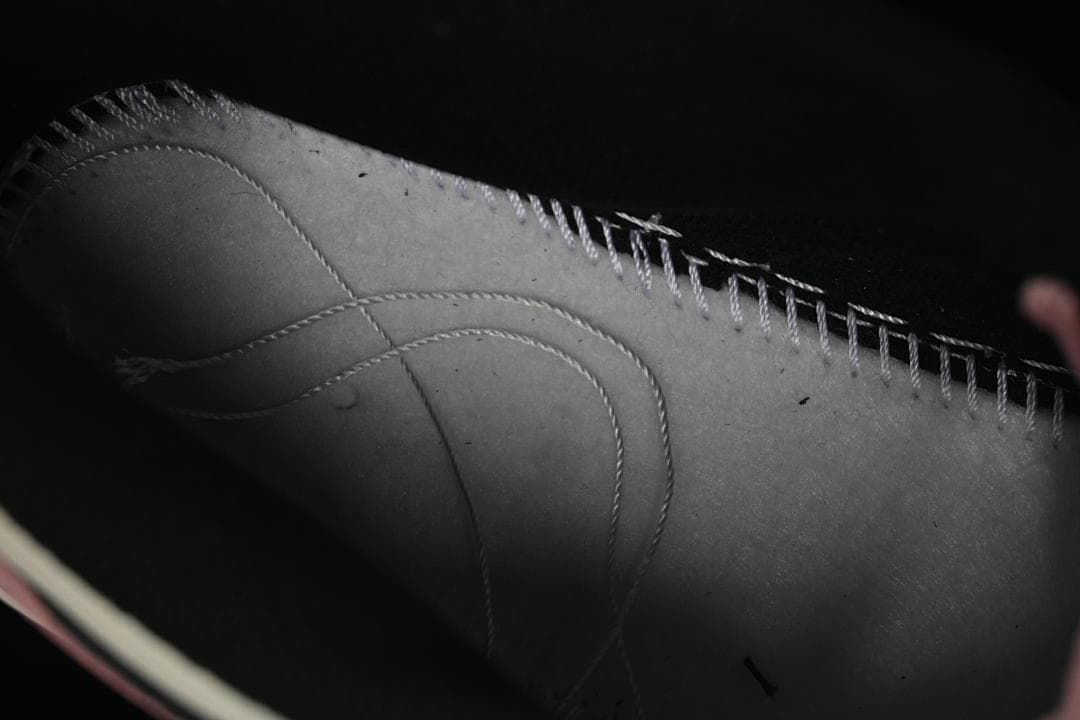 Close-up of stitching and panel details inside the shoe