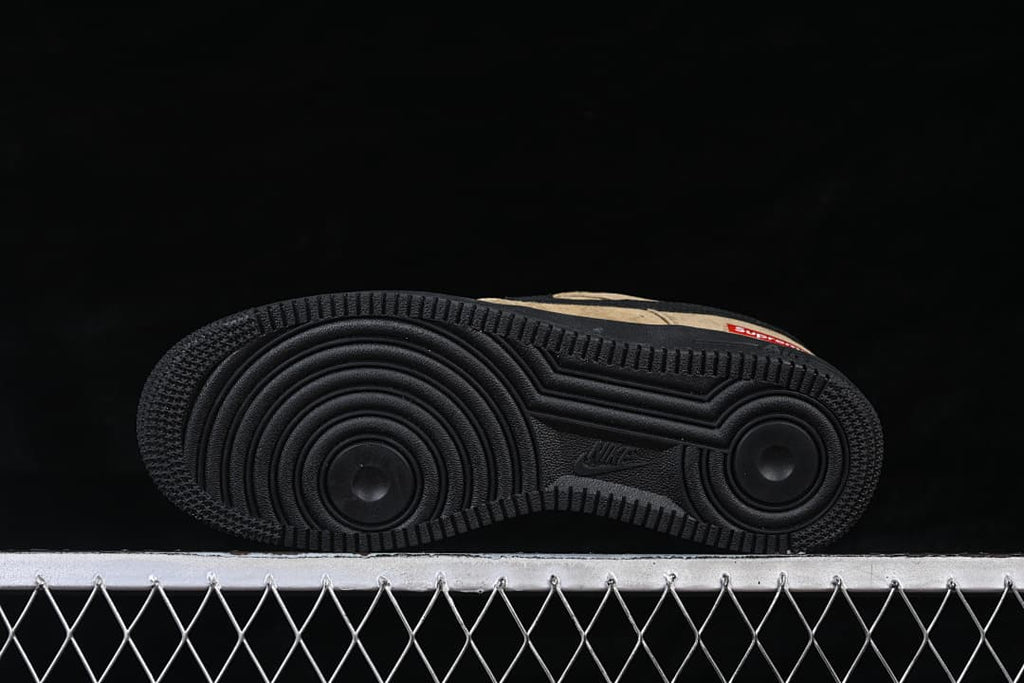 Underside of a black-soled low-top sneaker