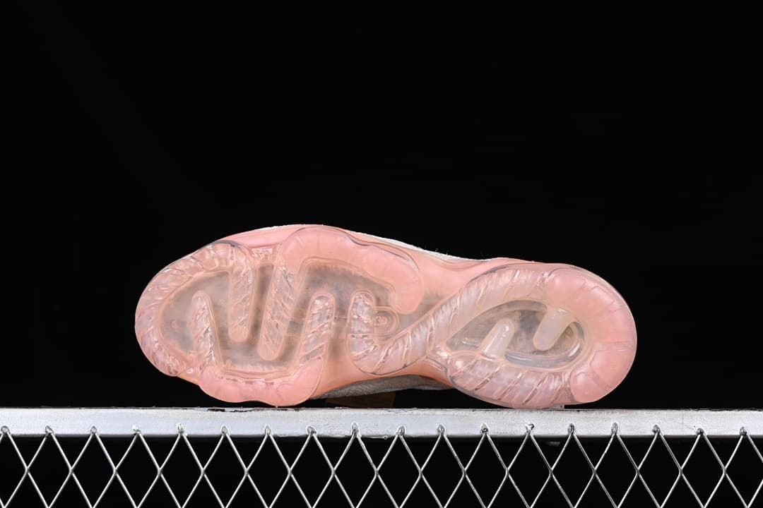 Underside view showing the translucent pink-toned sole.