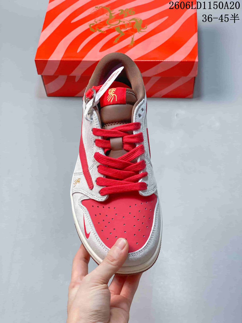Top view showing red laces, a perforated red toe panel, and contrasting overlays.