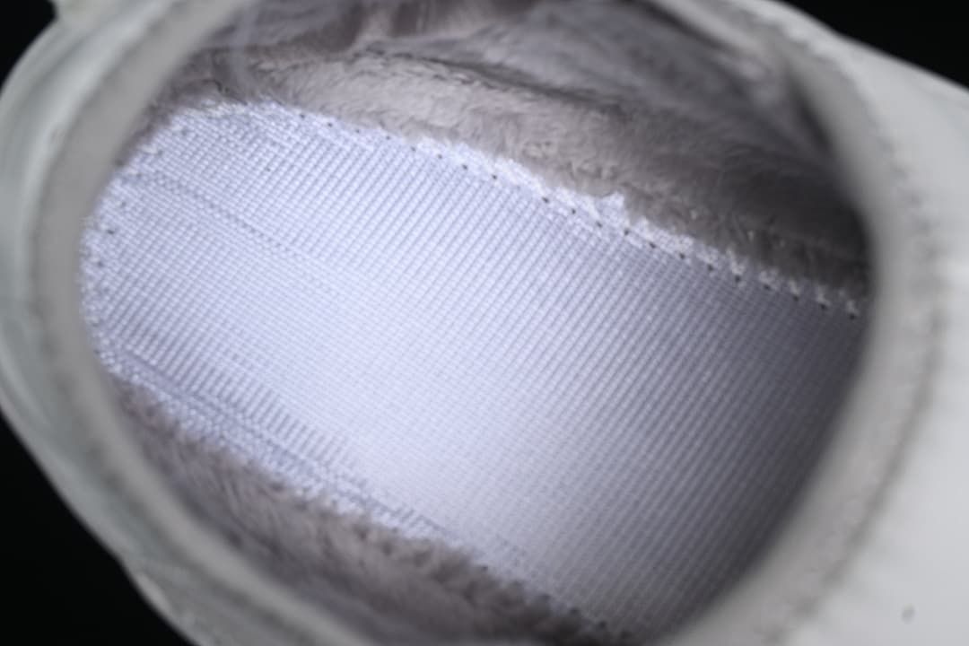 Close-up inside the slipper showing the size label and lining.