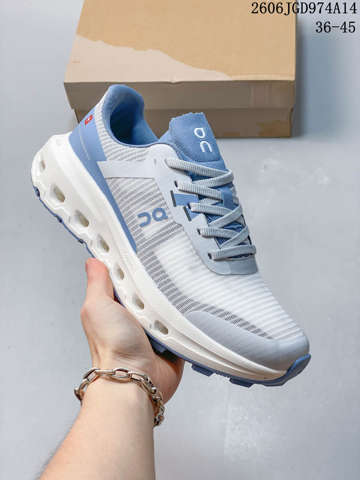 Angled side view of a white and blue On Cloudvista 2 shoe