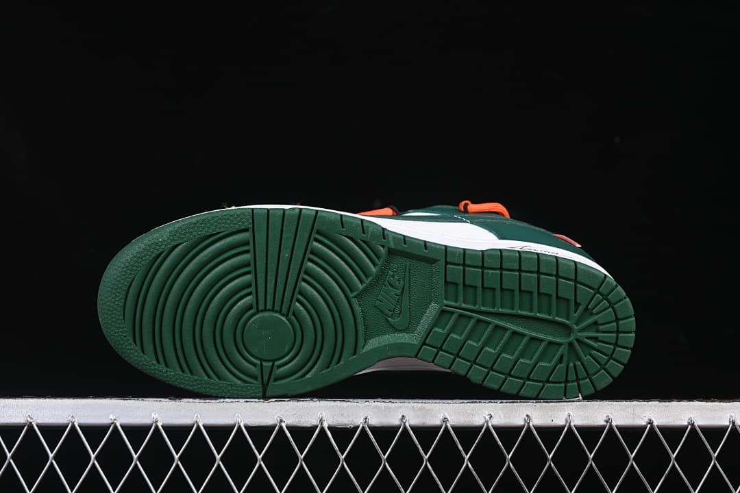 Underside view showing the green rubber outsole tread