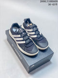 Navy Adidas Climacool lace-up shoes with off-white side stripes and soles, pictured on a Terrex box.