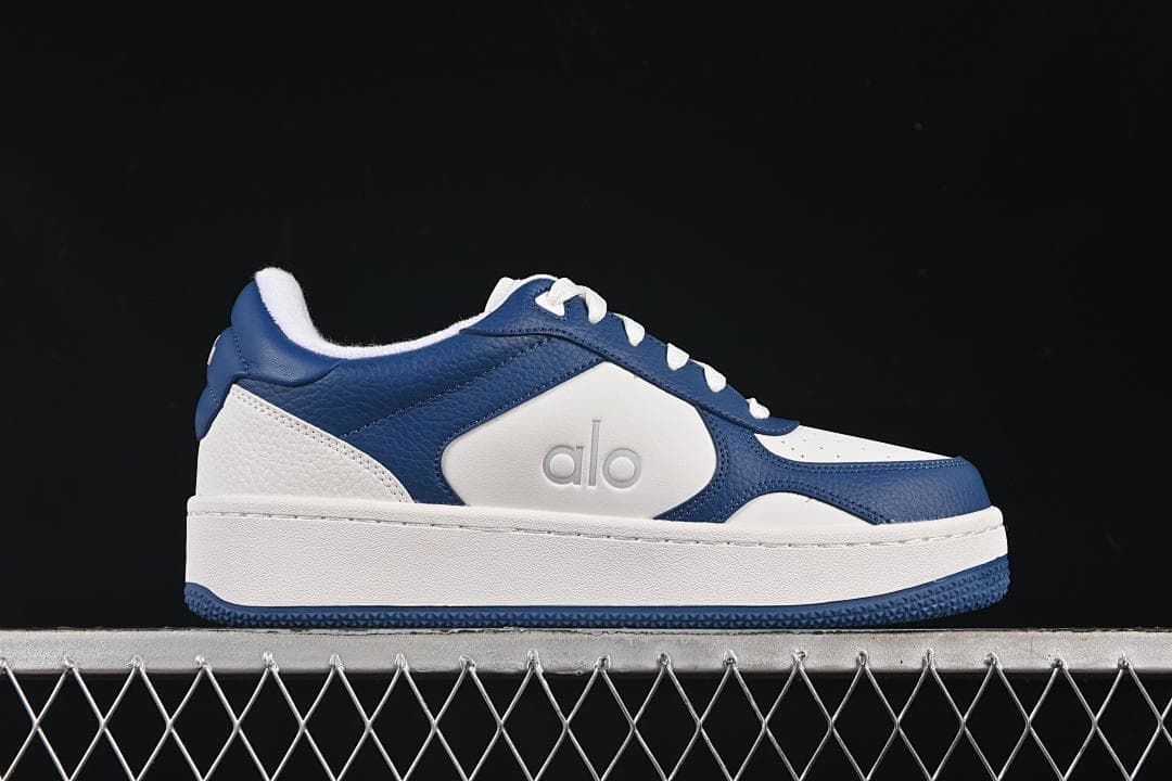 Side profile of a navy and white Alo Recovery Mode sneaker