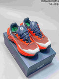 Pair of rust-brown, navy, and bright orange Kailas FUGA trail shoes shown from above