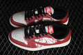 Pair of red, white, and black low-top sneakers shown from above, with illustrated side panels.