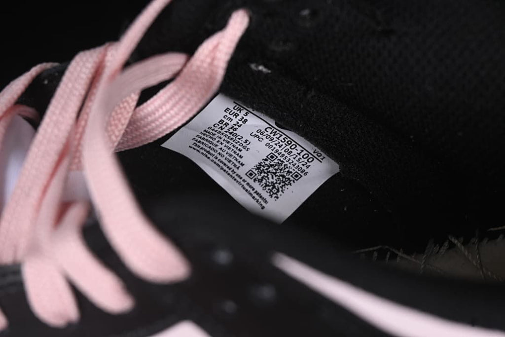 Shoe size label visible beside pale pink laces