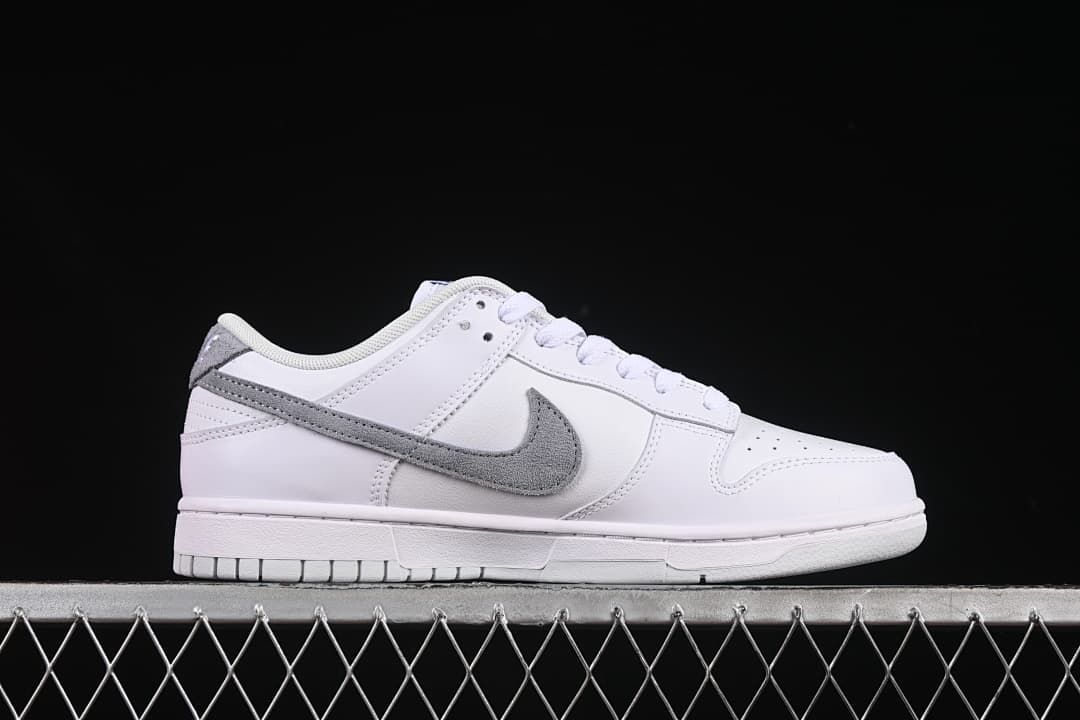 Side profile of the white and grey low-top sneaker