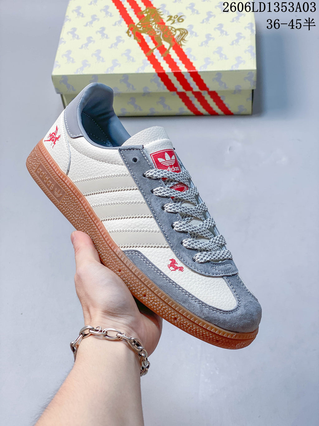 White Gazelle Indoor sneaker with gray-blue accents, patterned laces, and a gum outsole.
