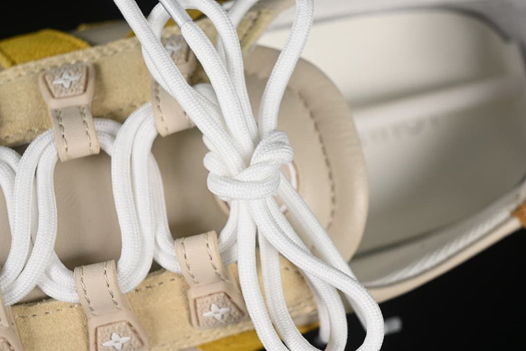 Detail of white laces and decorative lace tabs