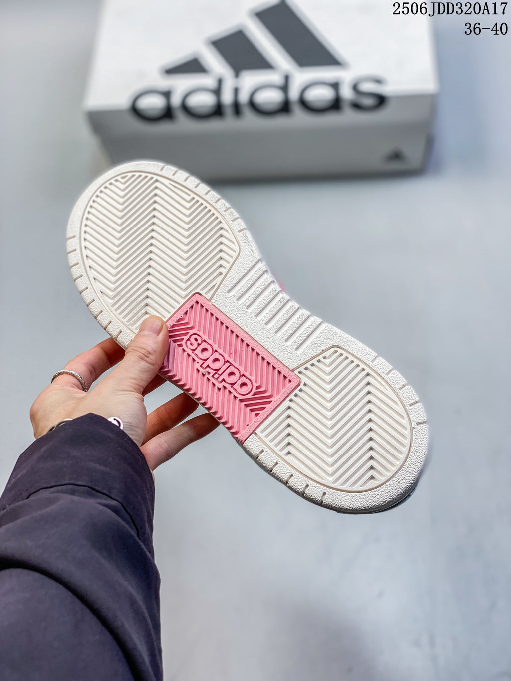 Close-up of the adidas sneaker outsole with patterned tread and a pink center section