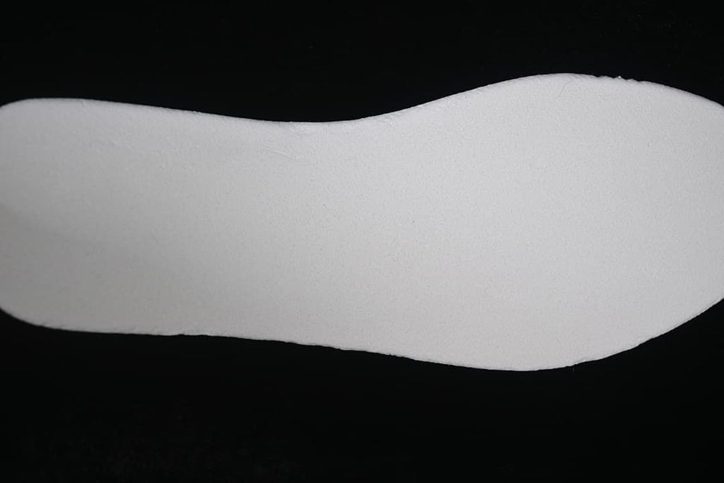 Close-up of a plain light-colored shoe insole