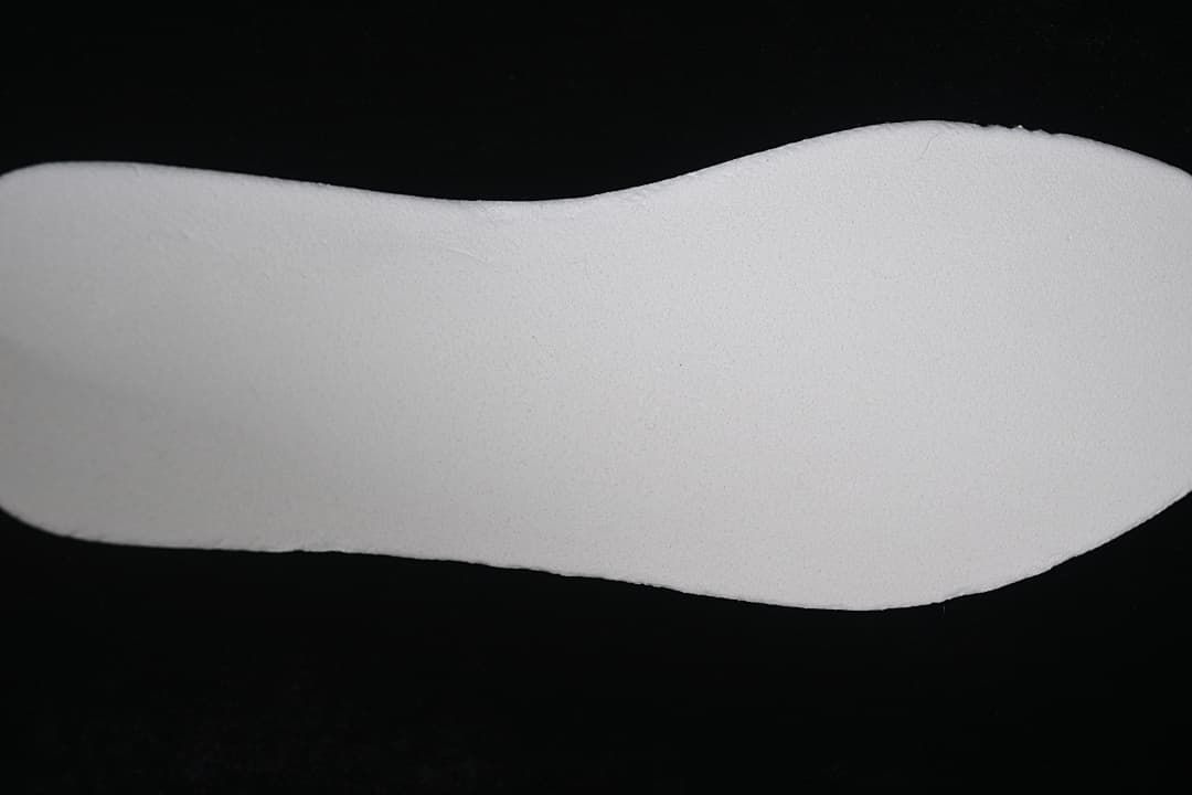 Close-up of a plain light-colored shoe insole