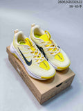 Pair of off-white and yellow Nike Wildhorse 10 trail shoes on a Nike Trail box