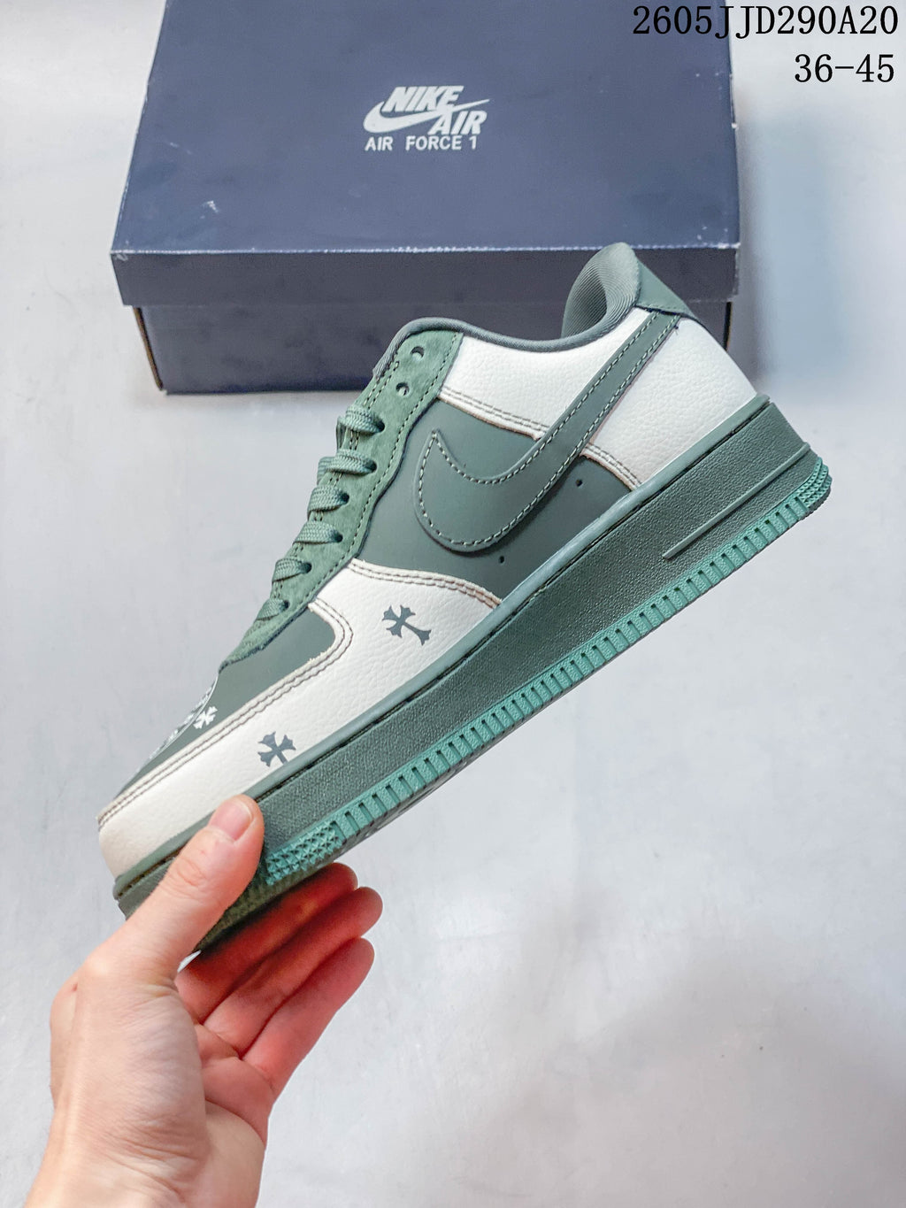 Side view of the low-top sneaker with layered green and cream panels