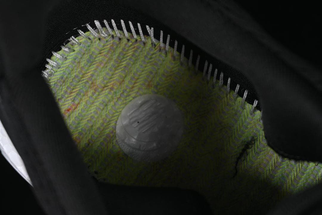 Interior close-up showing the knit lining and cushioning insert.