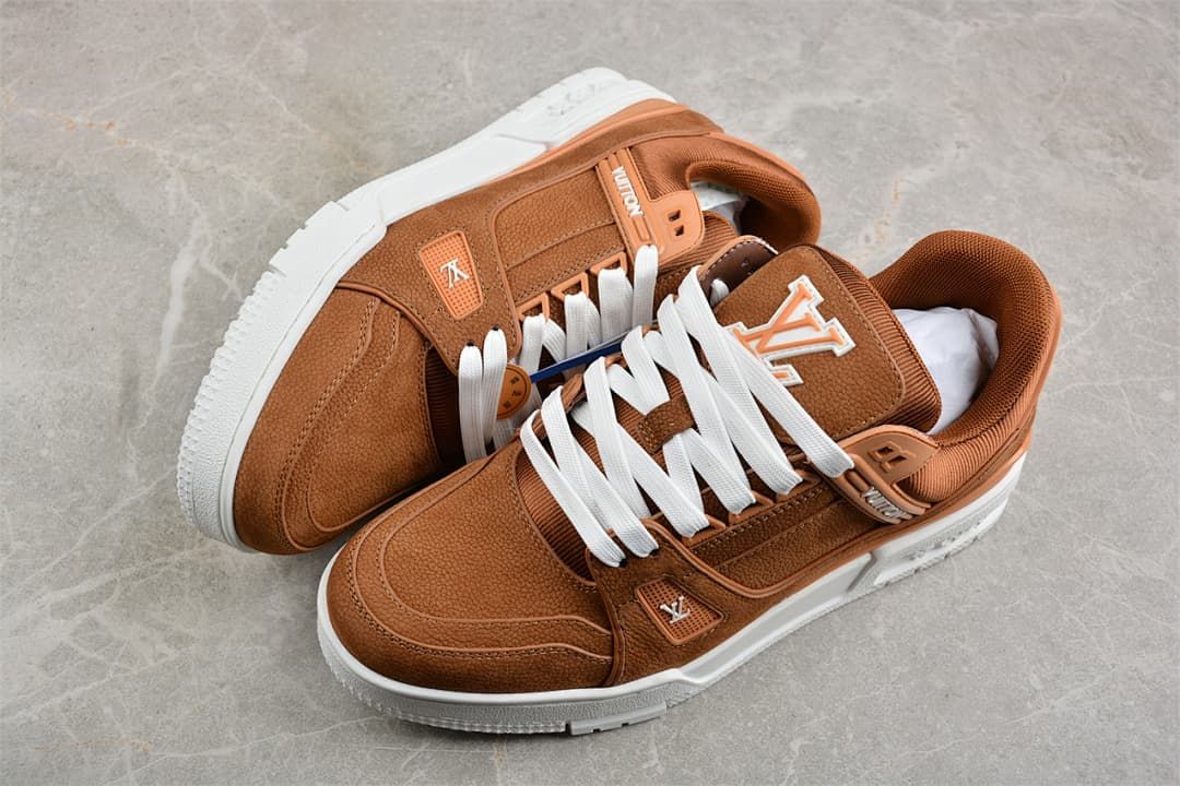 Pair of brown LV Trainer sneakers with white laces and white soles