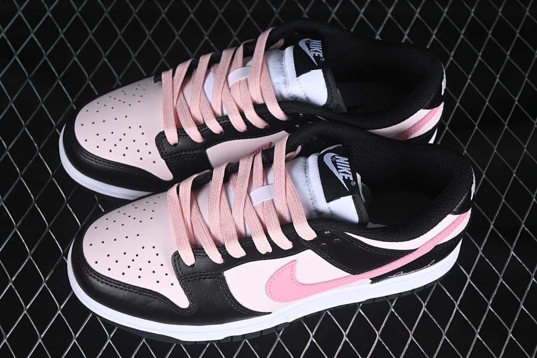 Pair of black, pale pink, and white low-top sneakers viewed from above