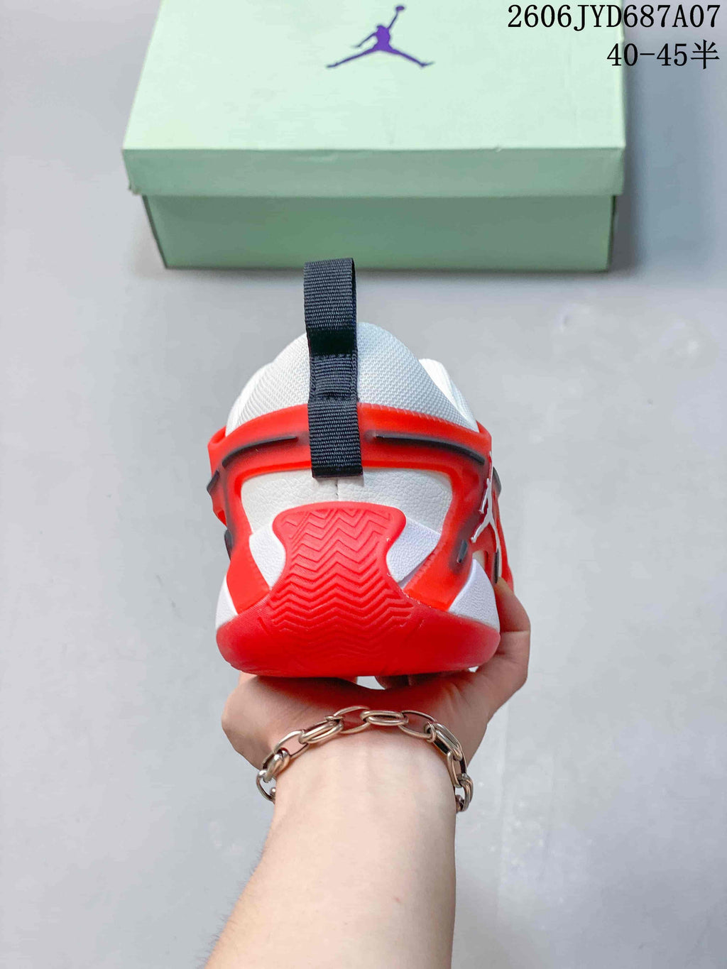 Rear view of the white and red Jordan Heir PF shoe