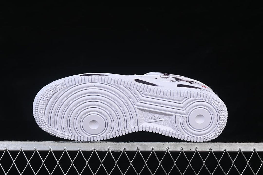 View of the white outsole with circular tread patterns