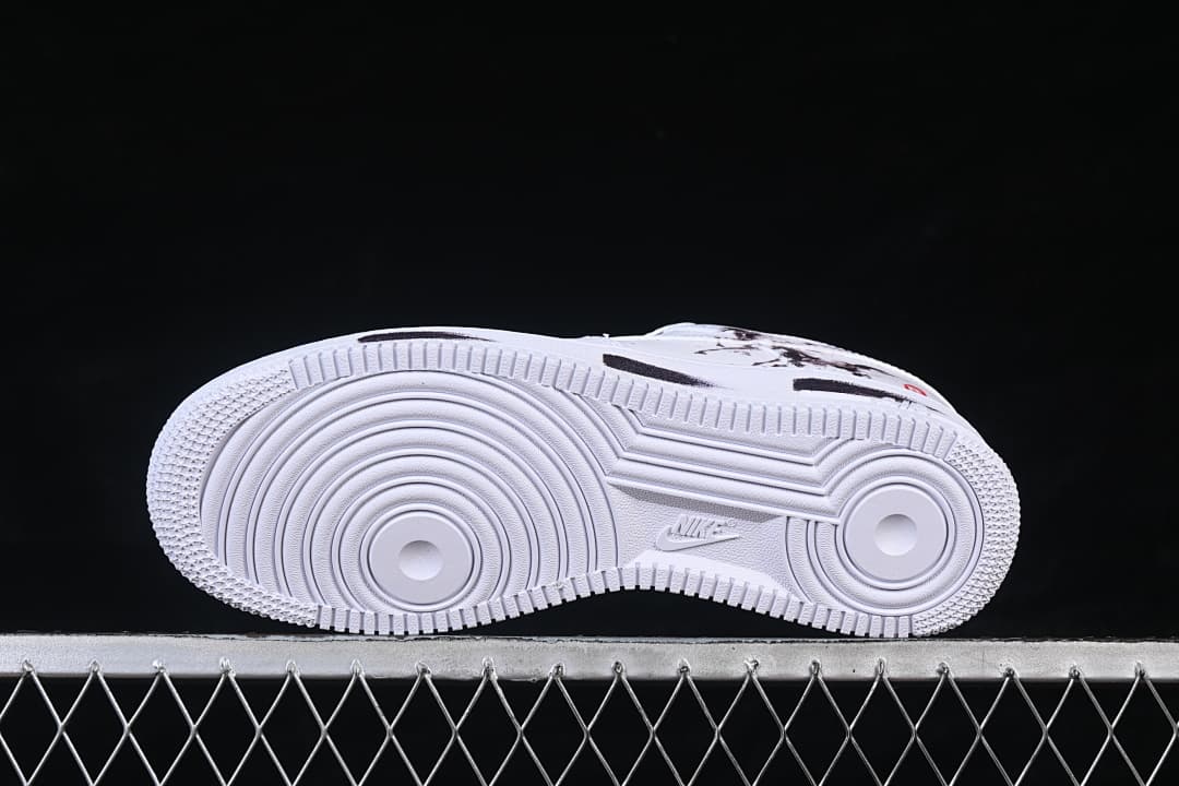 View of the white outsole with circular tread patterns