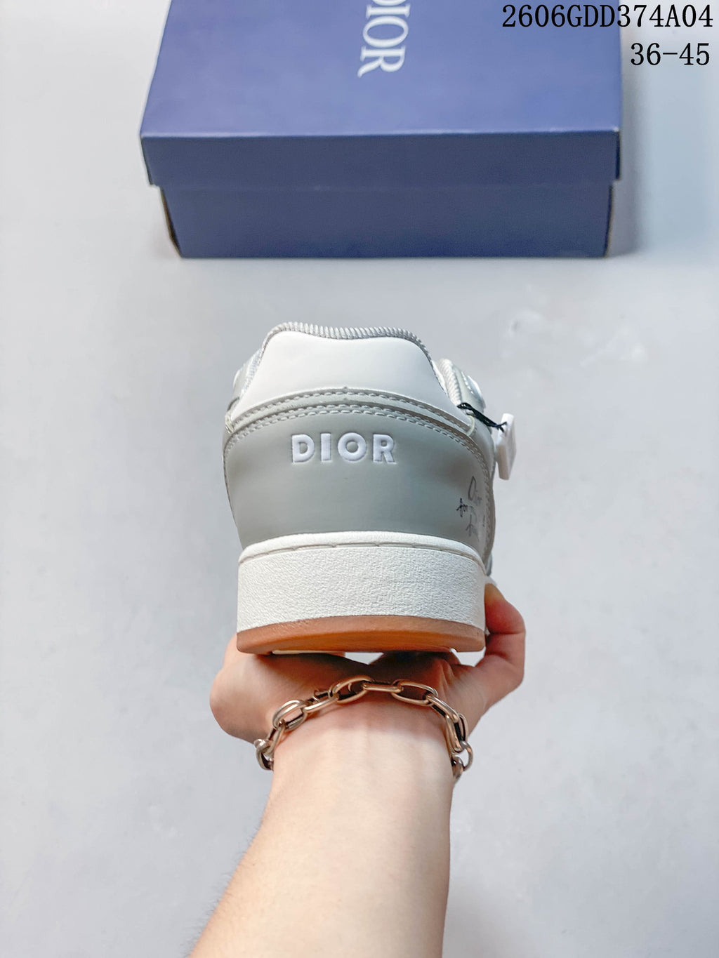 Rear view of the sneakers with Dior branding on the heel