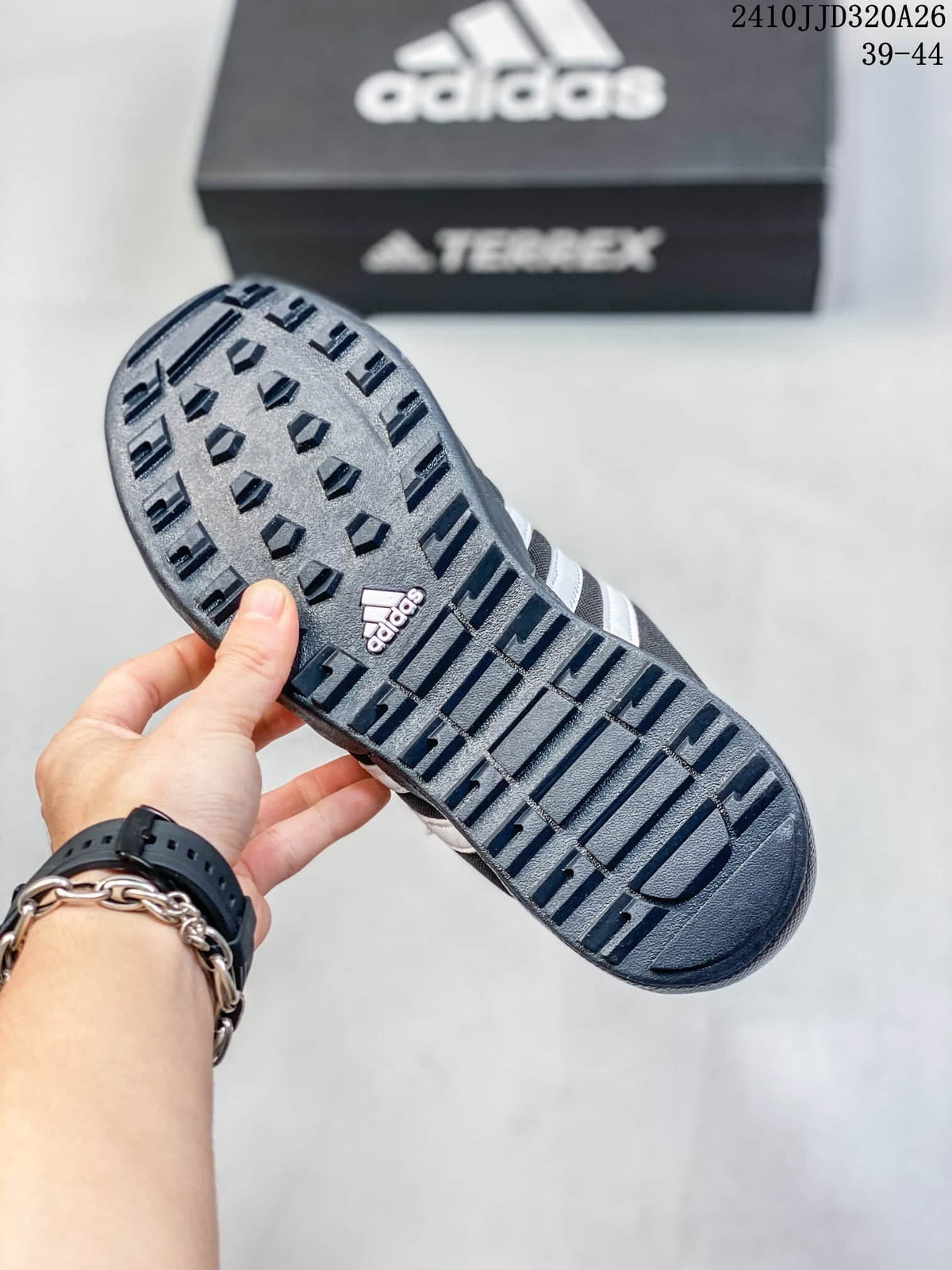 Close-up of the adidas shoe outsole showing raised tread.