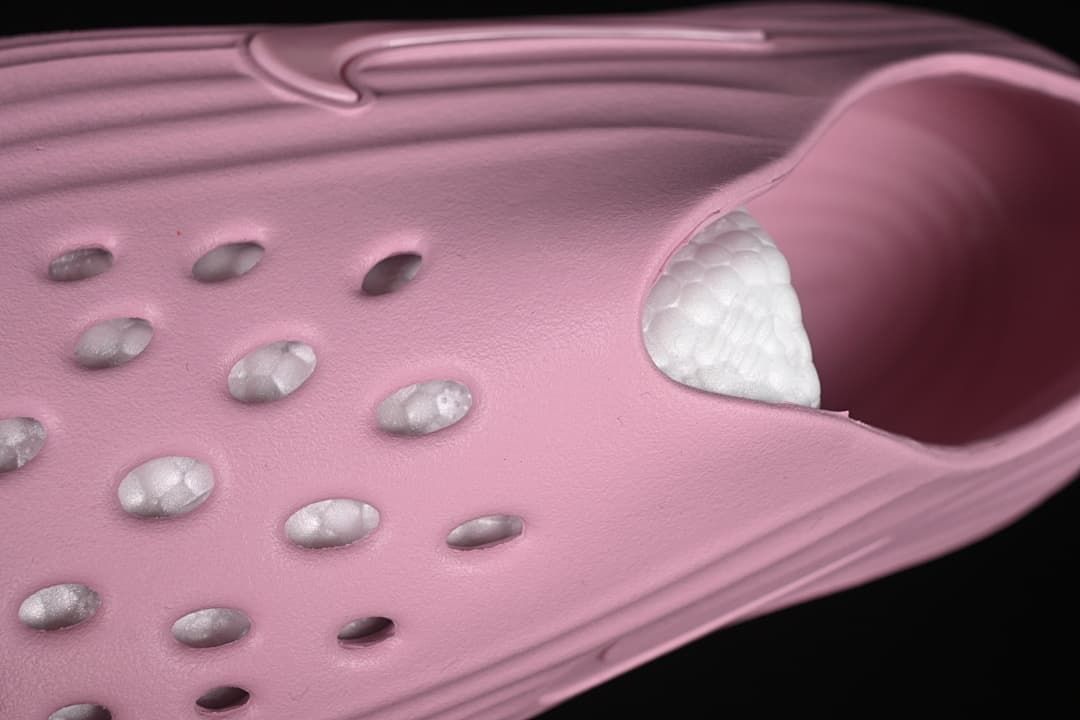 Angled close-up of the perforations and interior of the shoe.