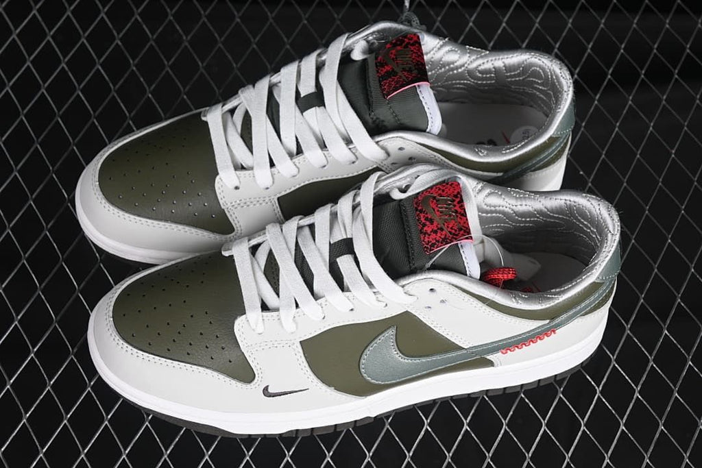 Pair of white and olive low-top sneakers shown from above and the side.