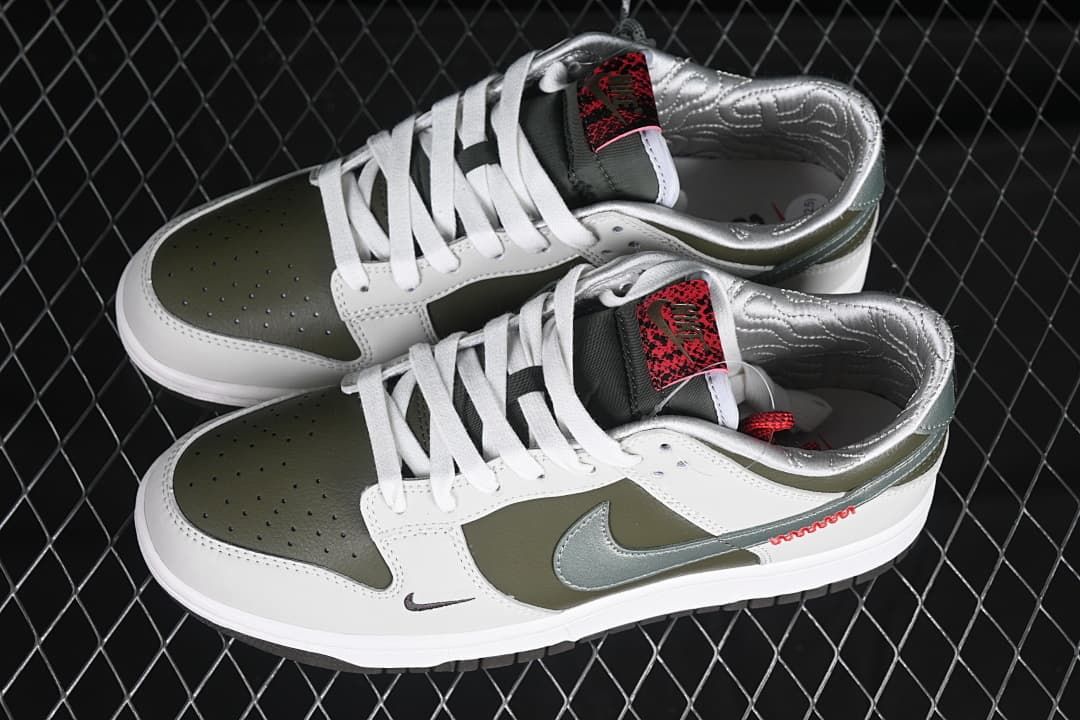 Pair of white and olive low-top sneakers shown from above and the side.