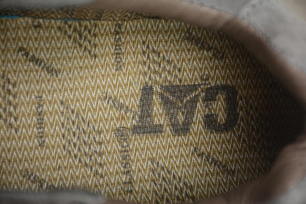 Close-up of the patterned mesh lining inside the sneaker.