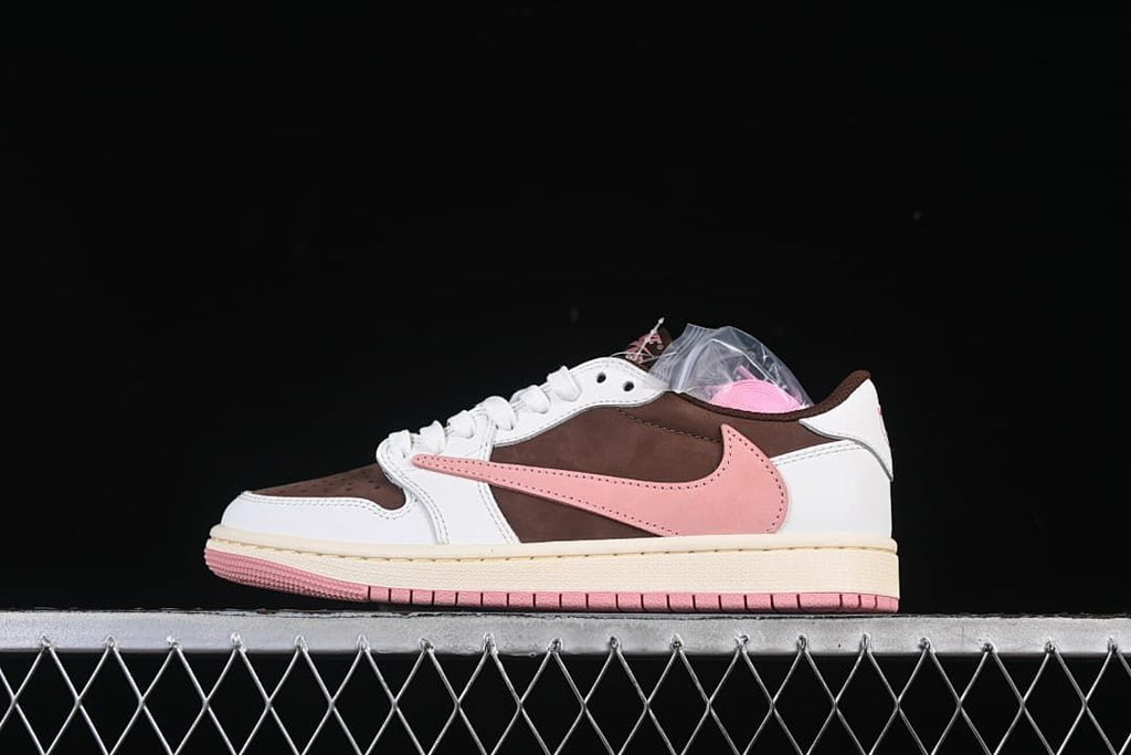 Side view of the low-top sneaker in brown, white, and pink.