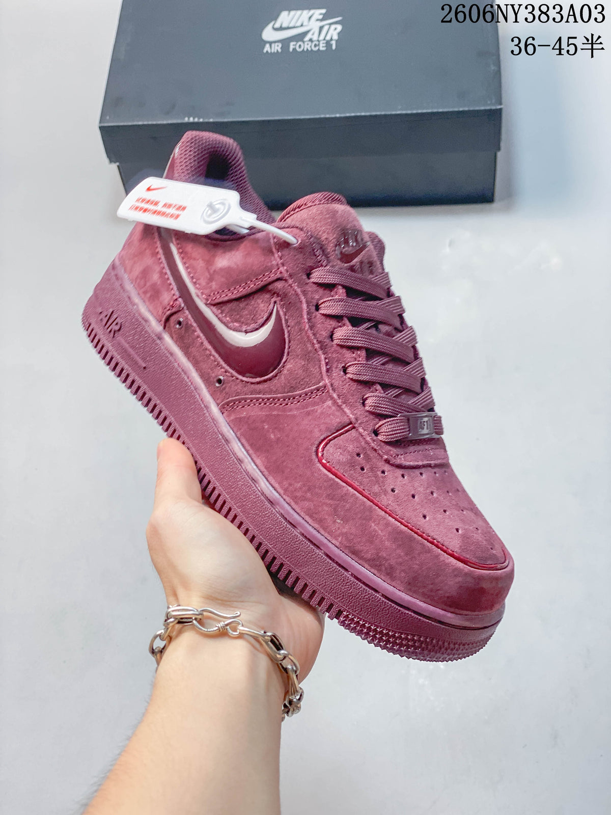 Deep rose Nike Air Force 1 low-top sneaker shown from the side