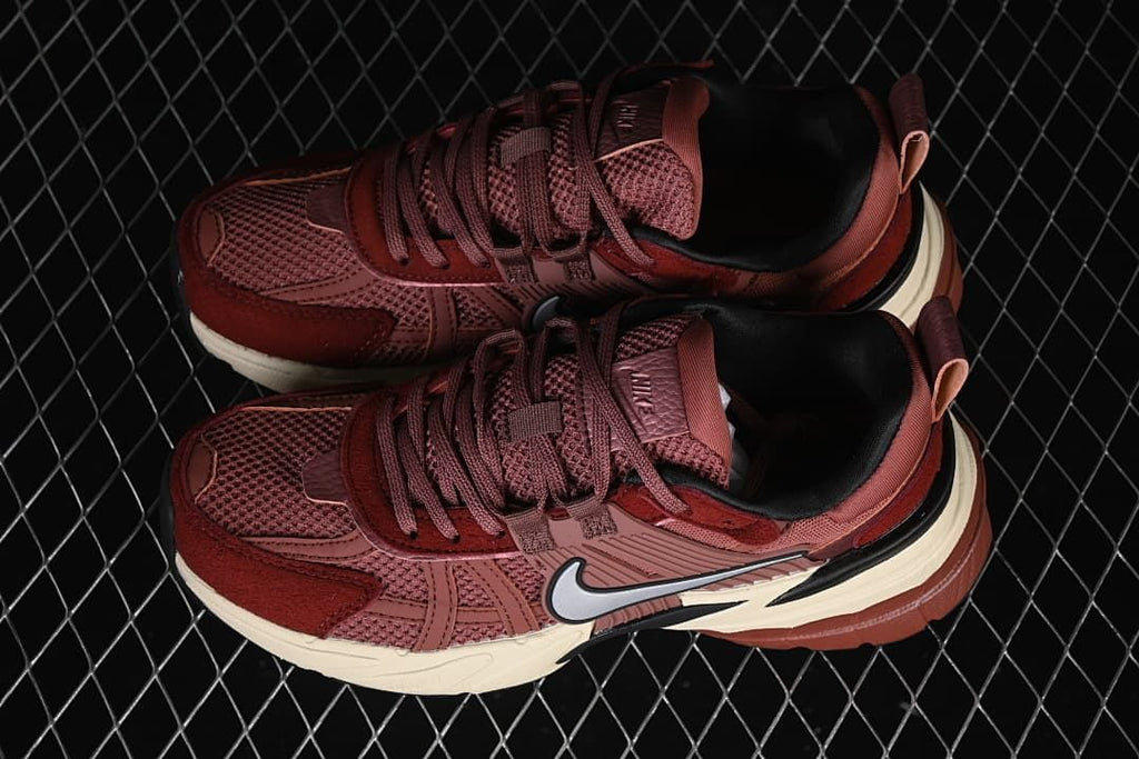 Pair of burgundy Nike V2K Run sneakers photographed from above