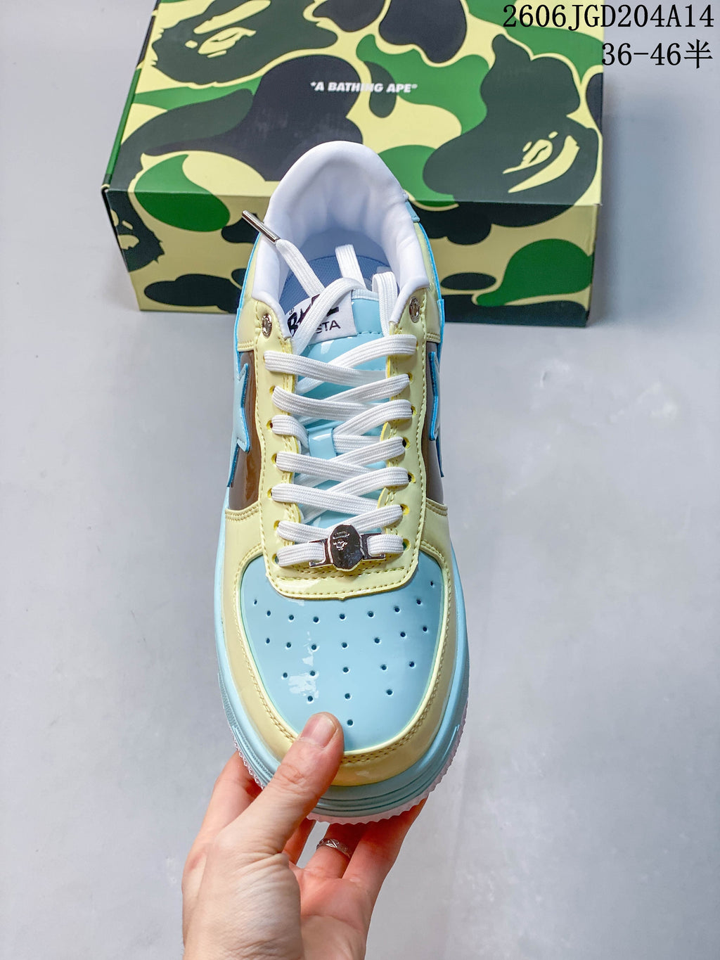 Top view of the BAPE STA sneaker showing its perforated toe, white laces, and color-blocked panels