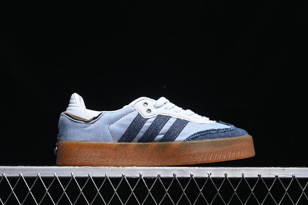 Side profile showing the raised gum-colored sole and denim-look panels