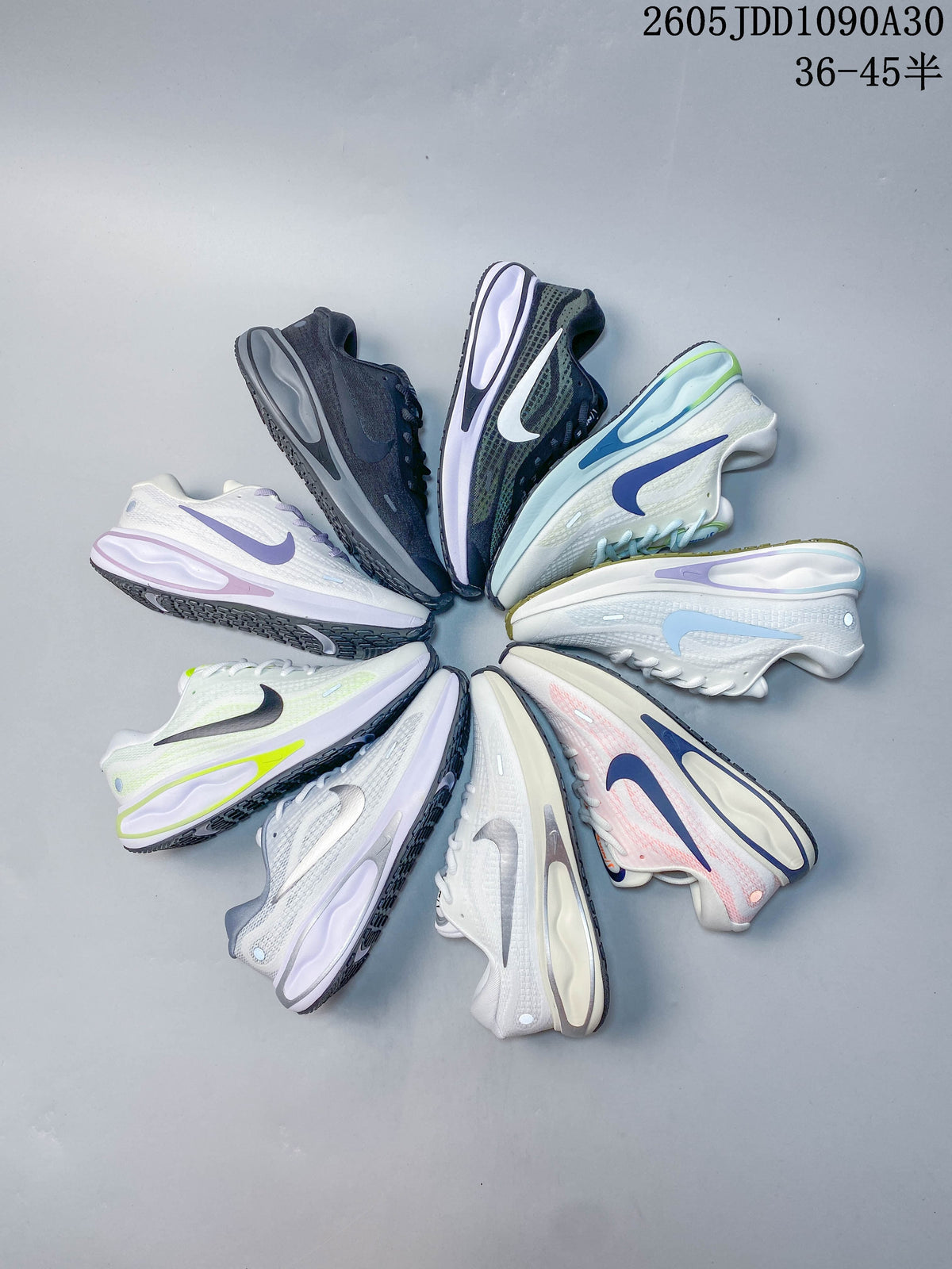 White Nike Journey Run running shoe with pale blue accents and a patterned upper.