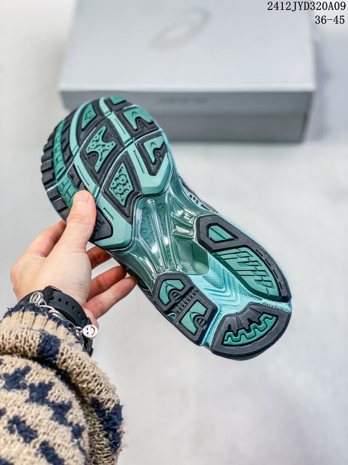 Close-up of the teal and dark outsole tread of an ASICS sneaker; image text shows 36–45 and 2412JYD320A09.