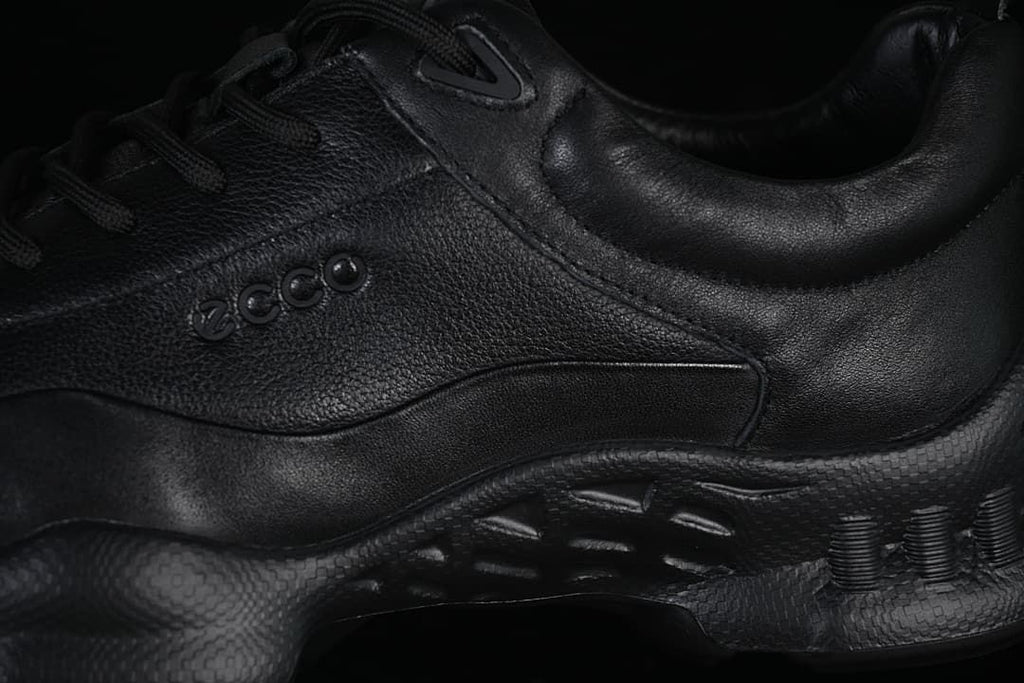 Side detail of the black ECCO upper and sculpted sole