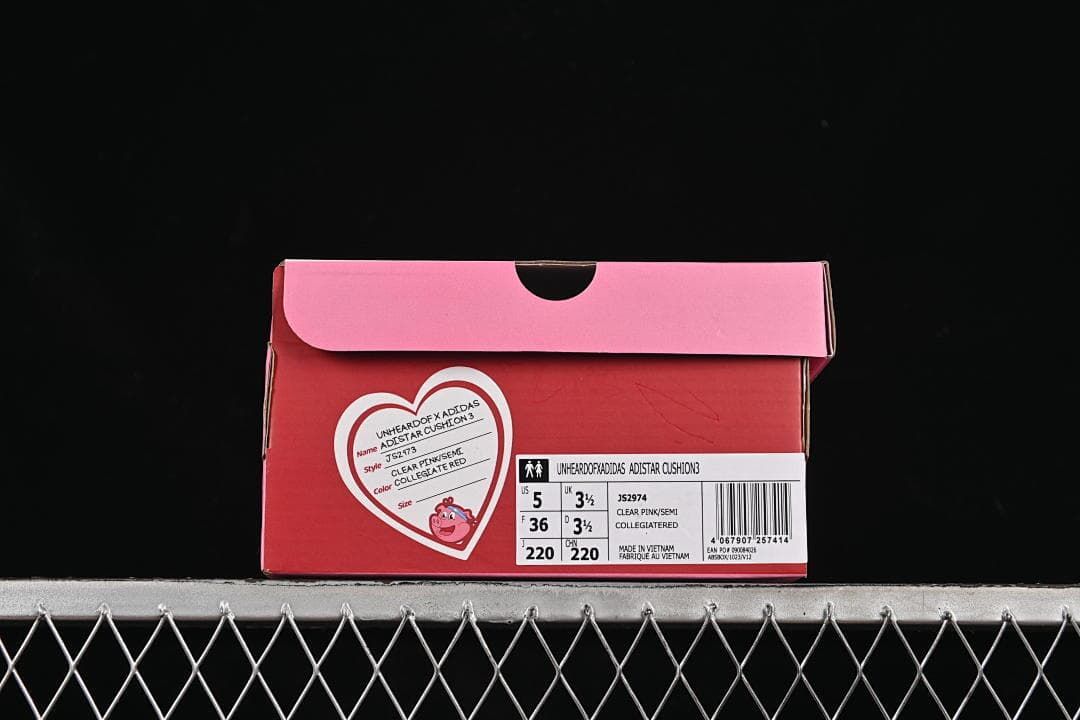 Pink shoe box label displaying model name, style code JS2974, color information, and sample size.