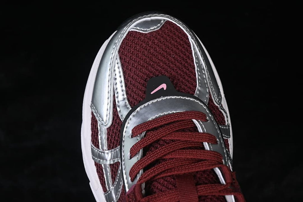 Top-front close-up of the mesh toe and metallic silver overlays