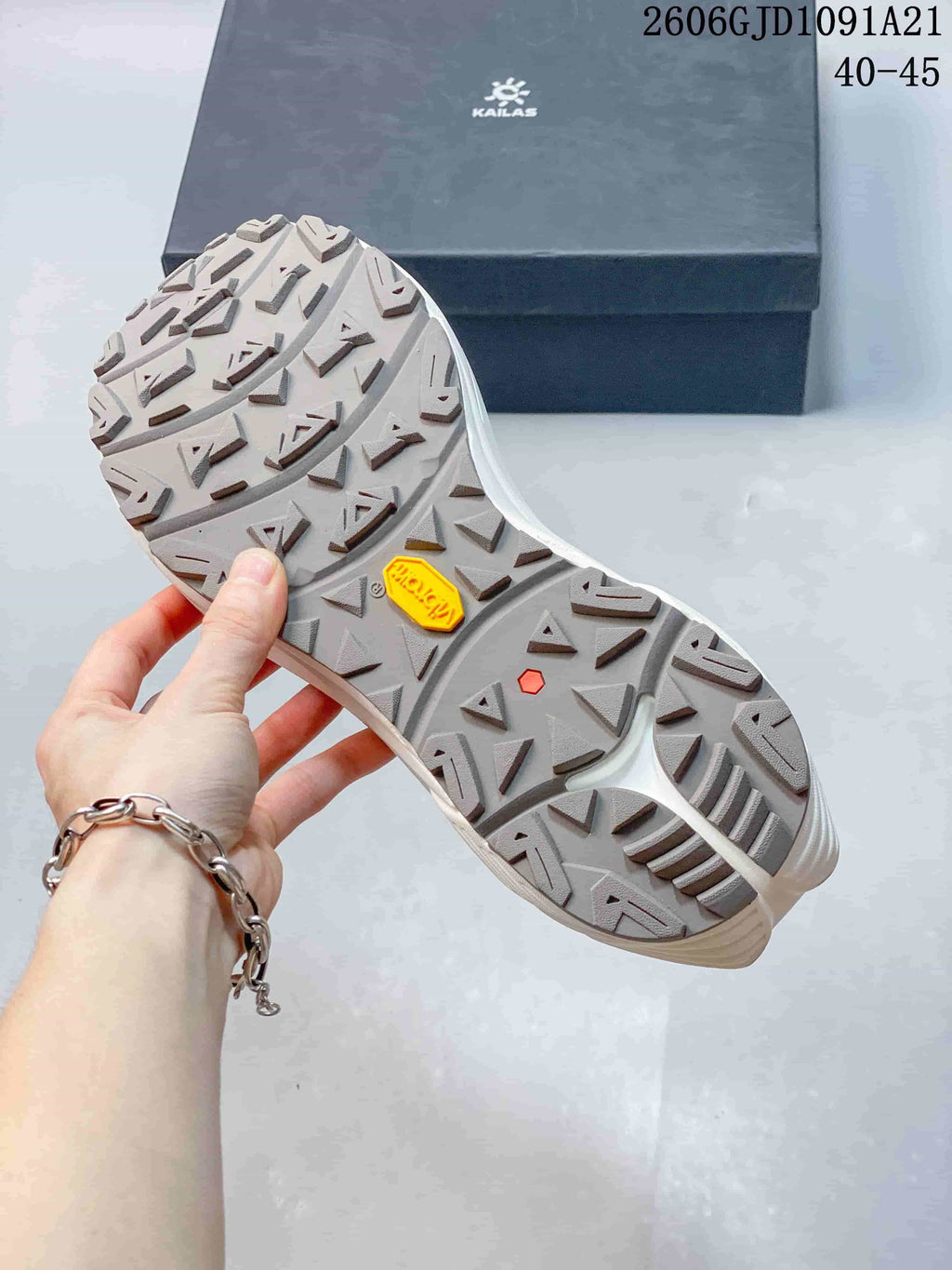 Close-up of the trail shoe outsole with deep, angular tread