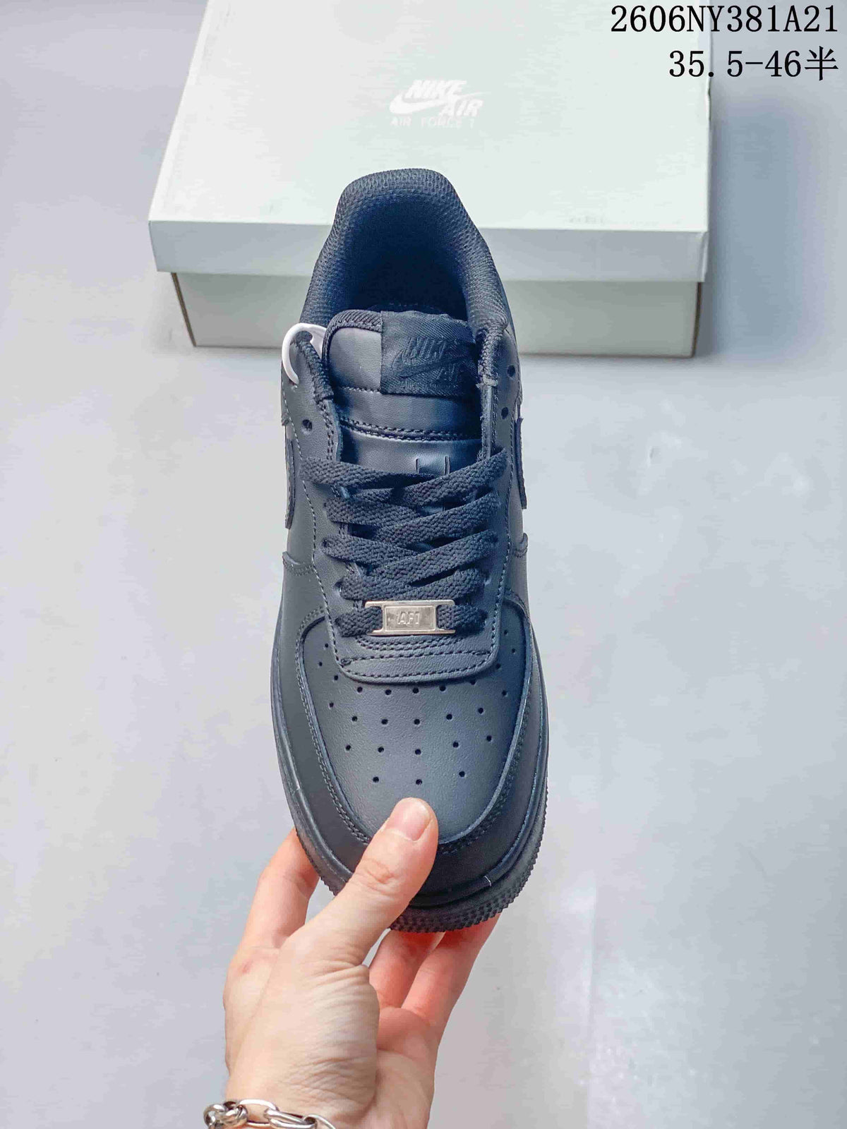 Top view of a dark blue lace-up sneaker with perforated toe