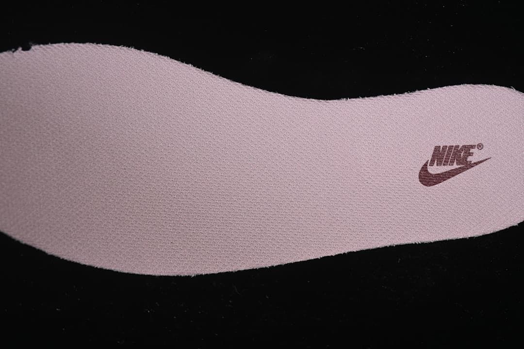 Close-up of the textured shoe insole with a Nike mark