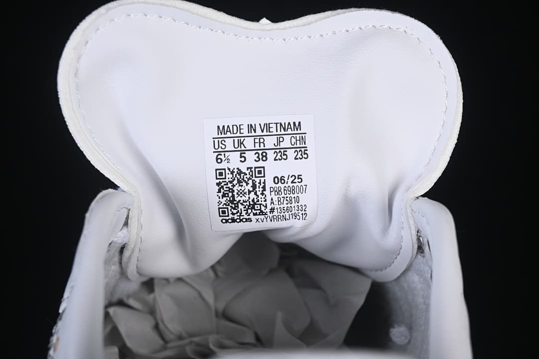 Sneaker tongue size label showing US 6.5, UK 5, FR 38, JP 235, and CHN 235.