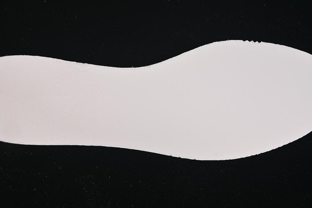 Close-up of the plain white sneaker outsole