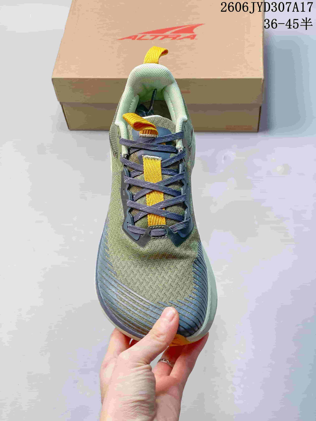 Top view of the running shoe showing its laces and patterned upper.