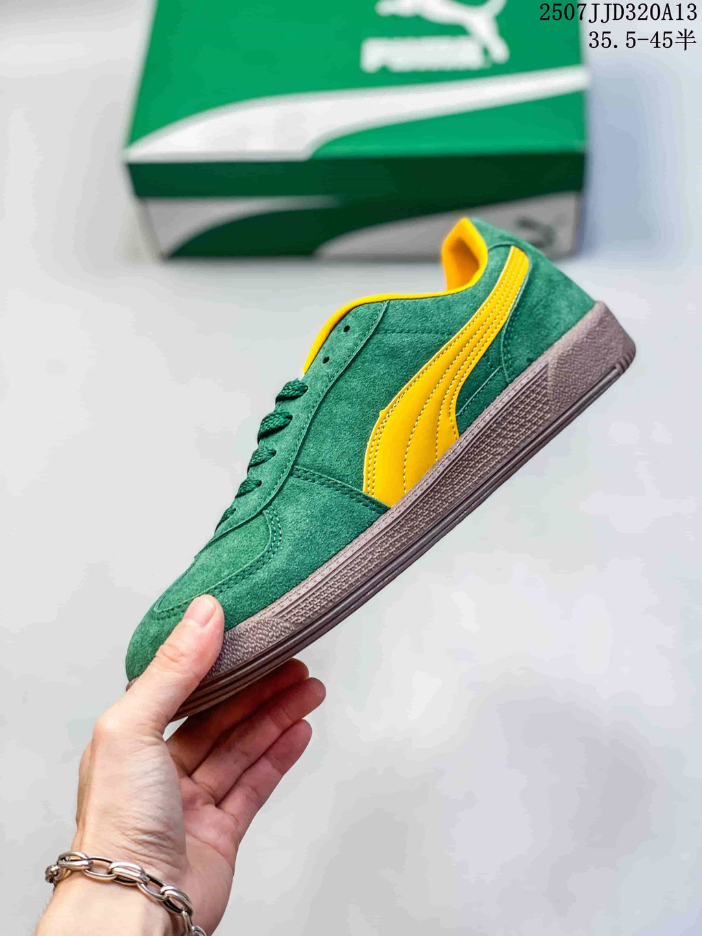 Side profile of a green low-top PUMA sneaker with yellow stripe and brown sole.