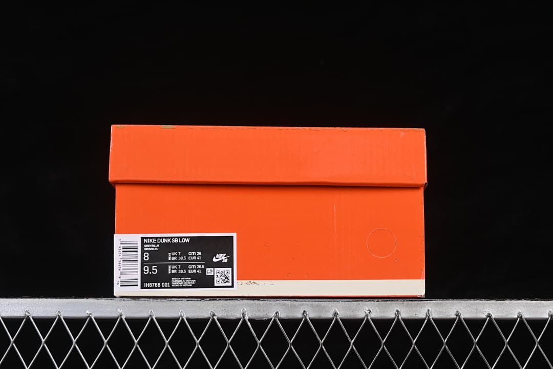 Orange shoe box with a label reading Nike Dunk SB Low and style code IH6766 001